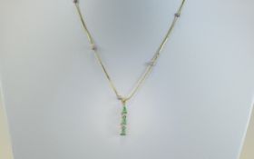 9ct Gold Emerald And Diamond Pendant Suspended On A Fine Link Chain