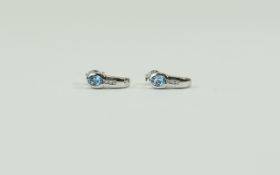 Pair Of Ladies 9ct White Gold Hoop Earrings each set with diamonds and a blue topaz