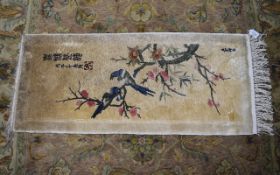 Genuine Hand Knotted Oriental Rug beige ground with bird in foliage decoration. Approx 43 by 18.