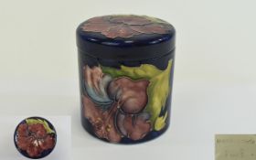 Moorcroft - Round Lidded Jar, Coral Hibiscus on Blue Ground, Impressed Moorcroft Marks to Underside.