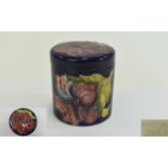 Moorcroft - Round Lidded Jar, Coral Hibiscus on Blue Ground, Impressed Moorcroft Marks to Underside.