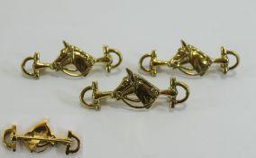 Collection of 3 silver gilt equestrian brooches, in the form of riding crops with a horses head.