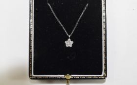 9ct White Gold diamond pendant set with a cluster of round modern cut diamonds suspended on a fine