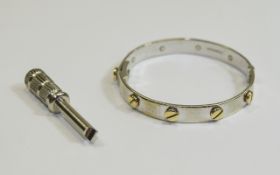 Child's 9ct White Gold Cartier Style Bangle. Hinged opening, with steel screwdriver.