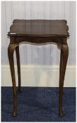 Occasional Table Small dark wood side or occasional table in dark wood with elegant legs.