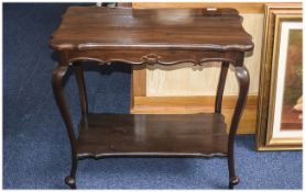 Occasional Table Dark wood rectangular table with bottom shelf. Curved legs.