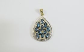 London Blue Topaz Pear Drop Pendant, eleven marquise cut London Blue topaz set in 14ct gold