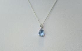 9ct White Gold Diamond & Chain. Pear shaped topaz with inner diamond set dropper.