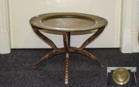 Anglo Indian Small Table with brass engraved charger top with folding teak base