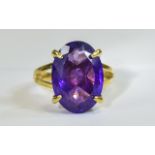 Amethyst Solitaire Ring, 11cts of rich purple amethyst in one oval cut stone, set in a simple but