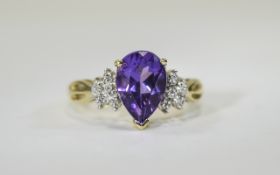 9ct Diamond and Amethyst Cluster Ring Unusual shoulder design and raised central setting featuring