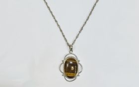 Silver Pendant With Tiger Eye Stone. Suspended on a silver chain. Pendant marked 925.