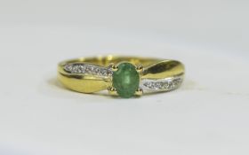 Silver ring set with central emerald with diamonds to the shoulders. Fully hallmarked.