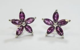 Pair of Rhodolite Garnet Flower Stud Earrings, five marquise cut rhodolite garnets to each flower,