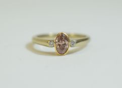 18ct Gold 3 Stone Ring Set with An Oval Brilliant Cut Natural Pink Diamond, Flanked by Two Round