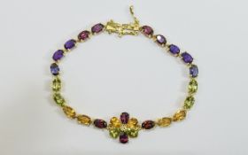 Garnet, Citrine, Peridot and Multi Gemstone Flower Bracelet, a tennis style bracelet with a flower,