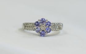 9ct White Gold Diamond Dress Ring set with a central Diamond surrounded by 6 Kunzite faceted stones