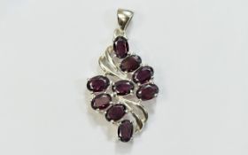 Indian Garnet Pendant, 6.75cts of the red garnet with flashes of blackcurrant, set in a silver