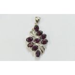 Indian Garnet Pendant, 6.75cts of the red garnet with flashes of blackcurrant, set in a silver