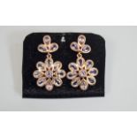 Rose de France Amethyst Flower Drop Earrings, each flower comprising eight pear cut amethysts