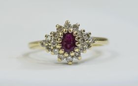 9ct Gold Ruby Cluster Ring set with a central Ruby surrounded by round cut Diamonds,