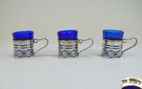 Edwardian Set of 3 Silver Finely Worked Drinks Cup Holders with Blue Glass Tots.