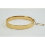 Victorian 15ct Rose Gold Hinged Bangle with Attached 15ct Gold Safety Chain. Marked 15 ct. 16.