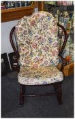 Dark Wood Rocking Chair Two floral seat pads, Slatted back, dark wood rockers with carved detailing.