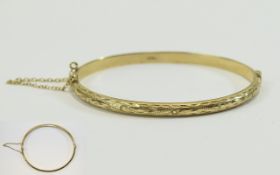 Ladies 9ct Gold Hinged Bangle with Safety Chain and with Chased and Diamond Cut Decoration. 6.