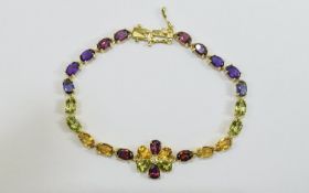 Garnet, Citrine, Peridot and Multi Gemstone Flower Bracelet, a tennis style bracelet with a flower,