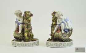 Late 19th Century German Unusual Pair of Hand Painted Porcelain Figural Bases with Cherubs Sitting