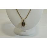 9ct Gold Set Large Faceted - Oval Shaped Amethyst Pendant with Attached 9ct Gold Chain.