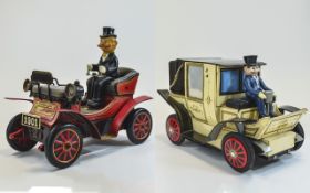 A Pair of Vintage Handmade Battery Driven Tin Cars with Seated Drivers From The 1950's.