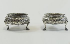 Early Victorian Pair of Silver Salts - With Embossed Decoration Raised on Hoofed Feet.