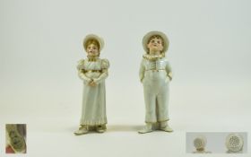 Royal Worcester Hand Painted and Fine Pair of Figural Casters,