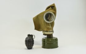 WWII Gas Mask together with a grenade.