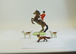 Beswick Model 868 Huntsman on Rearing Horse H10", together with 2 Beswick hounds & fox.