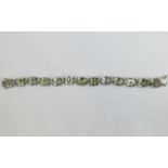 Green Amethyst Tennis Bracelet, 70cts of oval cut green amethyst set in platinum vermeil and silver,