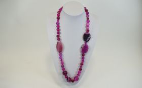 A Nice Quality Polished Pink Agate Necklace with Silver Clasp.