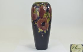 William Moorcroft Signed - Tube lined Tall Vase ' Pomegranates and Berries ' Design. c.1916 - 1925.