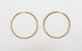 Ladies 9ct Gold Large Pair of Hoop Earrings. Marked 9ct. Each Hoop 1.25 Inches Diameter.