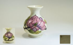 Moorcroft - Tube lined Globular Shaped Vase. Magnolia Design on Cream Ground. c.1970's. 5.