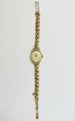 Omega - Ladies 9ct Gold Mechanical Wrist Watch with Attached 9ct Gold Diamond Cut Bracelet.