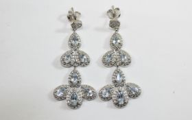 Aquamarine Pair of Articulated Long Drop Earrings, each earring comprising two articulated