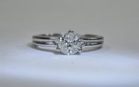 18 Carat White Gold Diamond Ring set with three round modern brilliant cut diamonds,