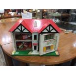 Dolls House, two storey dolls house with a collection of assorted dolls house furniture.