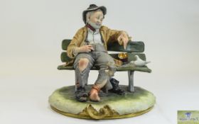 Capodimonte Early Signed Figure ' Tramp on Bench ' With Two Doves. Signed. Height 8.75 Inches.