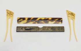 2 African Bone Hair Clips Together With A Chinese White Metal Comb Holder Showing Raised Images Of