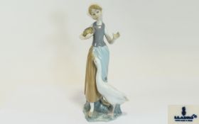 Lladro Porcelain Figure ' Girl with Duck ' Model 1052, Issued 1969 - 1998. Height 9.5 Inches.