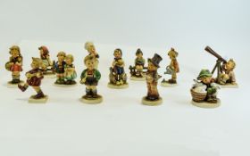 Collection of 12 Hummel Figures by Goebel including 'Trumpet Boy', 'Playmates Hasenvater', 'Baker',